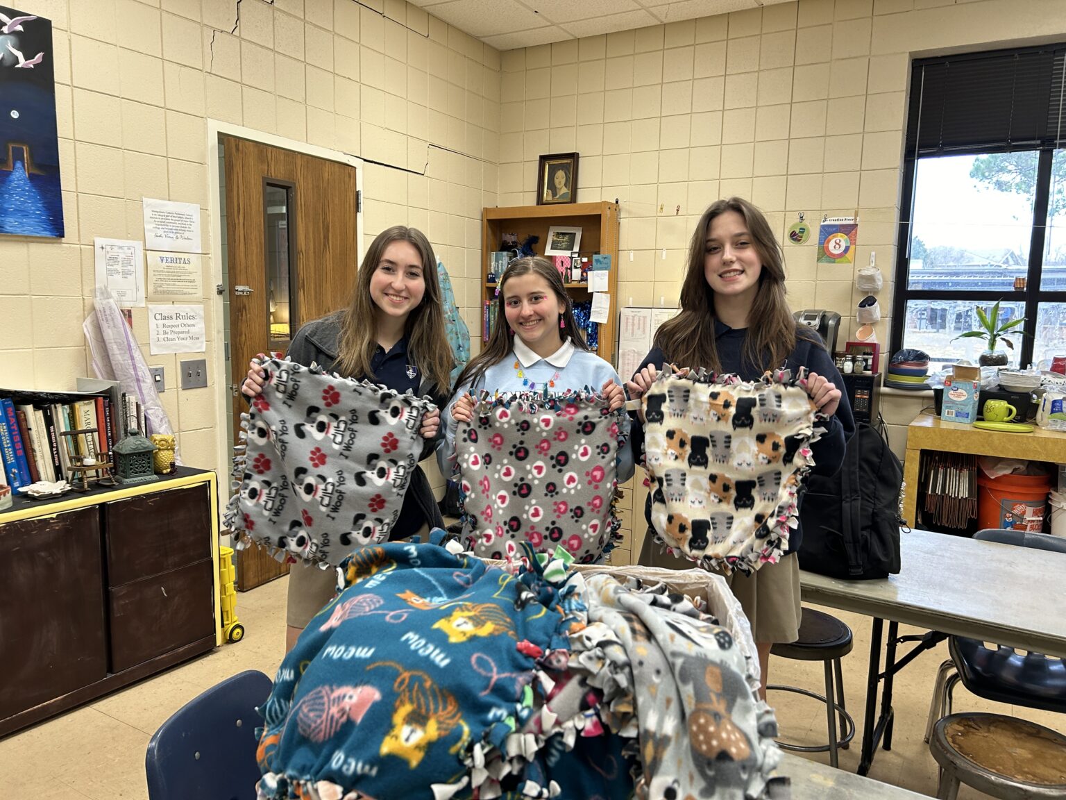 Montgomery Catholic Supplies Blankets to Humane Society’s Puppies and